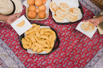summer day picnic blanket - empanadas, arepas  and bunuelos - traditional southamerican food