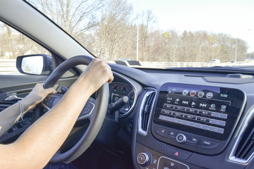 Man with hands on driving wheel