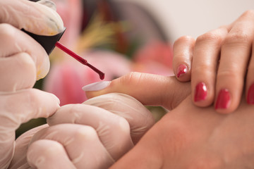 Woman hands receiving a manicure