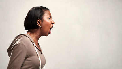 Angry screaming african american woman