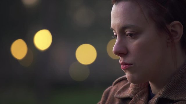 Depressed sad woman alone in the park in the afternoon