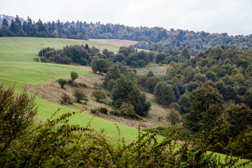Obraz premium fields in country under blue sky with white clouds