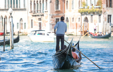 Fototapeta na wymiar Gondolier in Venice, Italy