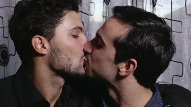 Portrait of Smiling gay couple kissing tenderly