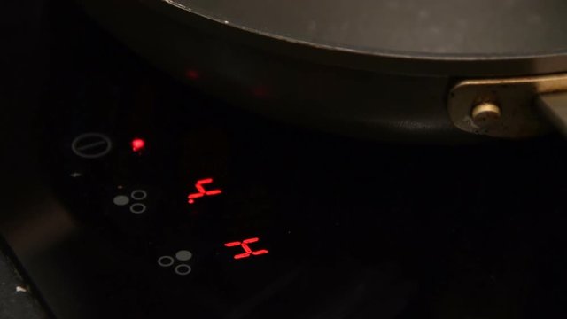 Close-up shot of heating induction cooker