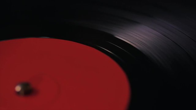 A retro-styled spinning record vinyl player. 4k