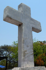 Empty headstone or gravestone against blue sky in a Christian Cemetery