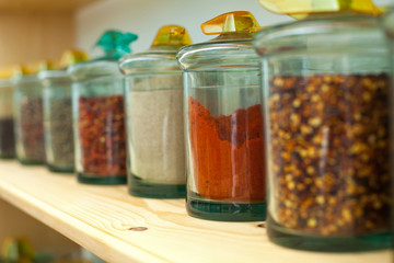 Fototapeta na wymiar Dried spices in glass jars