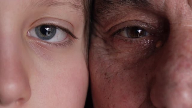 Eyes of grandfather and grandson, old and new generations