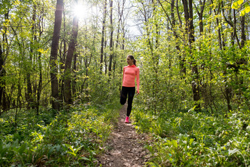 Fototapeta premium Runner girl green spring forest