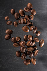 Flying coffee beans isolated on dark background