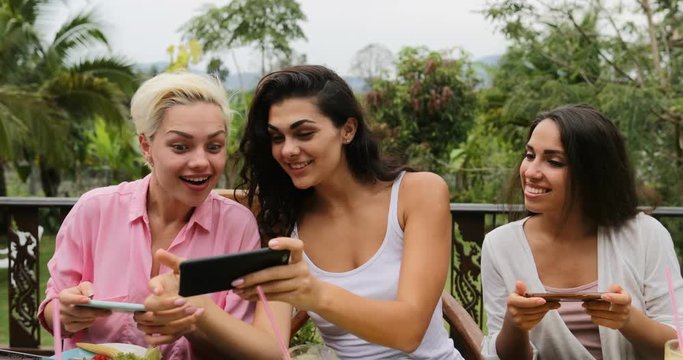 Girls Taking Photos Of Healthy Vegetarian Food On Cell Smart Phone, Friends Eating Sitting On Tropical Terrace Slow Motion 60