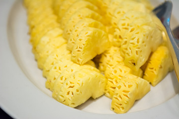 Pineapple fruit : Pineapple slices on white plate. Pine apple prepare for serve. Small pineapple slices and leaves in plate 