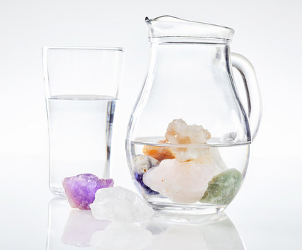 Healing stones in jug of water