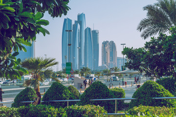 Walk in Abu Dabi. We can see the street, towers, buildings and lives.