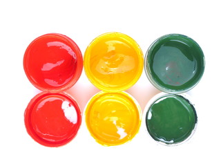 Jars with gouache on white background