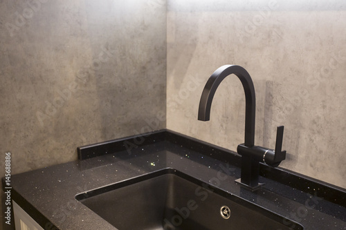 Modern Black Water Tab And Square Sink With Concrete Wall