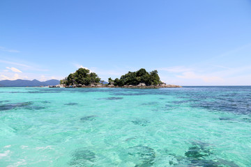 Tropical island country beautiful blue sea and clear blue sky,Image for summer fun party travel concept.