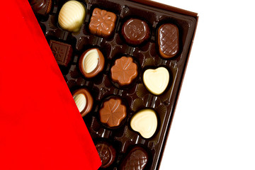 assorted chocolates in a box isolated on white