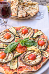 Veggie pizza on a table with copy space