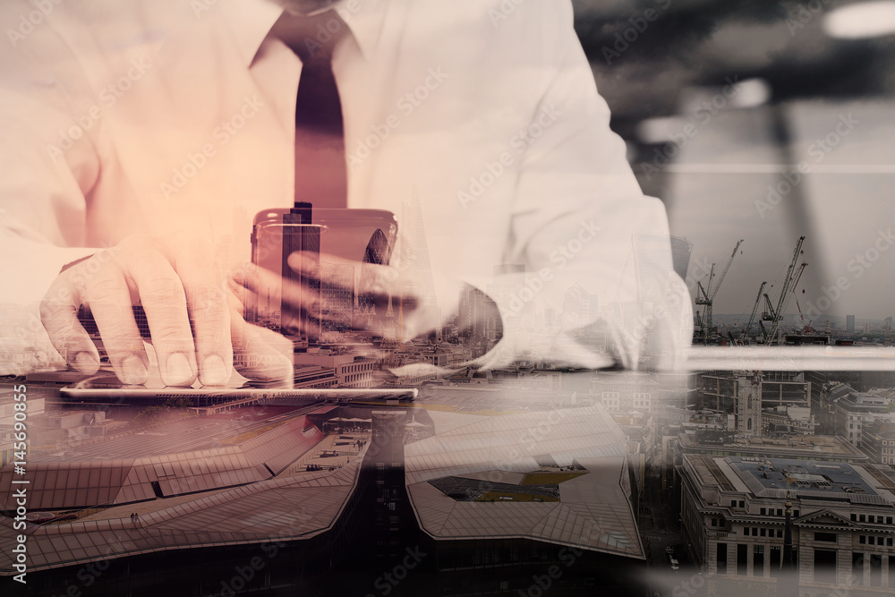Poster lawer working with smart phone and digital tablet computer in modern office