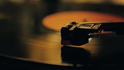 A retro-styled spinning record vinyl player. 4k. Close up. - Powered by Adobe