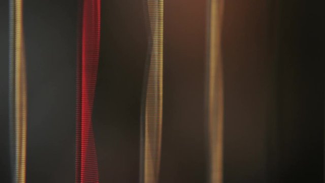 close up of strings vibrating while making music