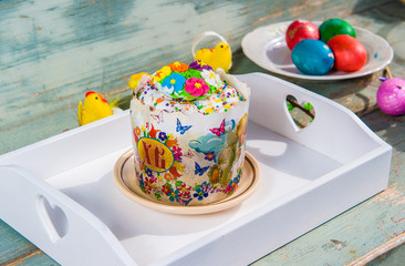 Easter Cake and easter eggs hand painted in home in easter basket