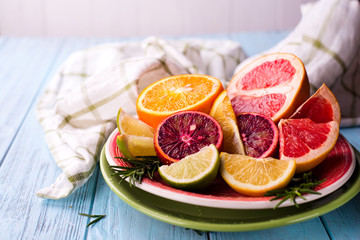 Fototapeta na wymiar Sliced citrus fruit on the plate