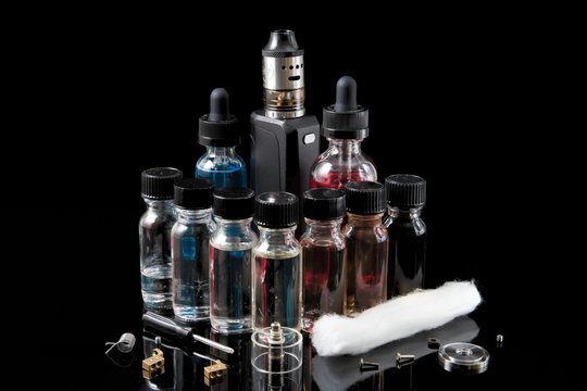 Electronic cigarette starter kit with juices and wick