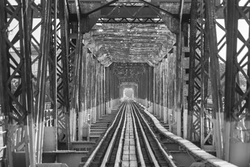 Hanoi, Vietnam - April, 2017: Long Bien Bridge (Vietnamese: Cau Long Bien) is an historic cantilever bridge across the Red River that connects two districts of Hanoi, Vietnam.