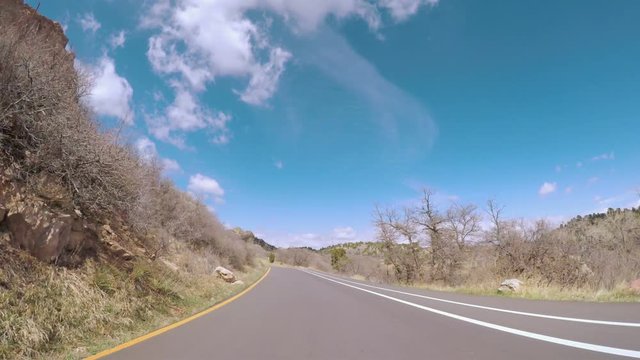 POV point of view - Driving through the park with large red sanstone formations