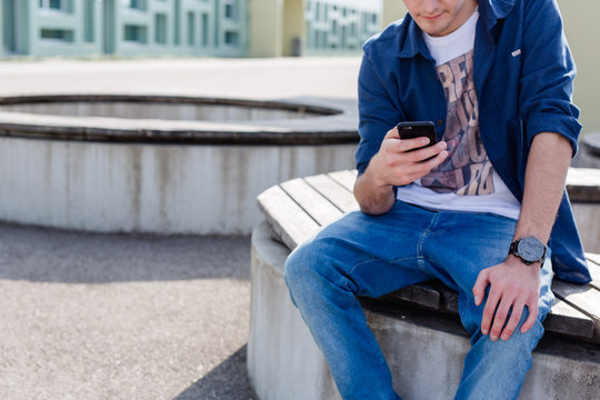 Young Man Checking His Phone