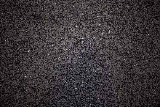Modern black stone floor close up background.