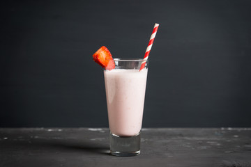 Strawberry milkshake on the rustic background. Shallow depth of field.