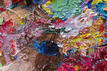 Palette with colorful mixed oil-paints texture