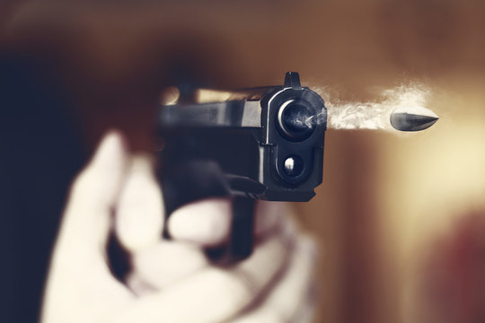 man with hand gun pistol rubber attack violence photomanipulation