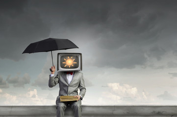 Man with TV instead of head . Mixed media
