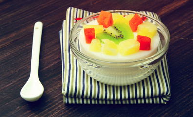 custard milk with fruit Salad dessert soft light vintage effect