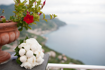 Peonies wedding bouquet, on background Amalfi Coast