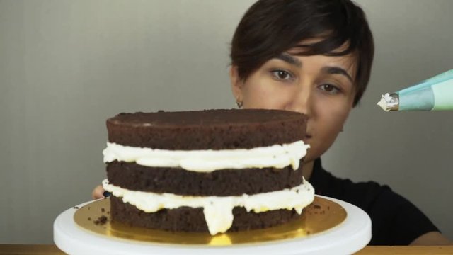 Pouring frosting on Cake. Making Chocolate Layer Cake. Series.