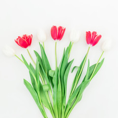 Red and white tulip flowers on white background. Flat lay, Top view.