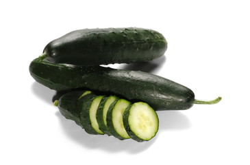 Cucumbers with slices isolated on white background