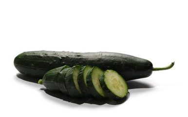 Cucumbers with slices isolated on white background