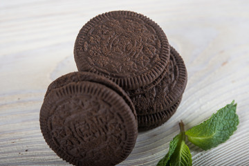 Chocolate biscuits on a light wooden background. Wafers with chocolate