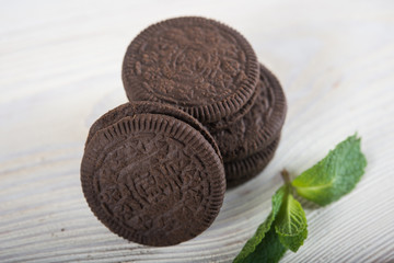 Chocolate biscuits on a light wooden background. Wafers with chocolate