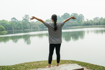 Happy woman feeling free in a beautiful nature - outdoor concept 
