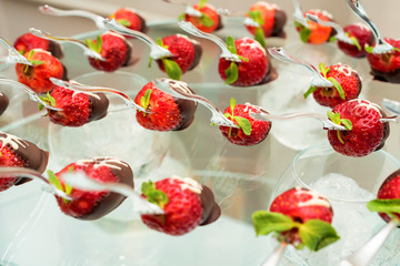 Chocolate dessert with cream and strawberry