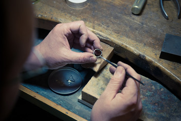 Goldsmith working on wedding ring