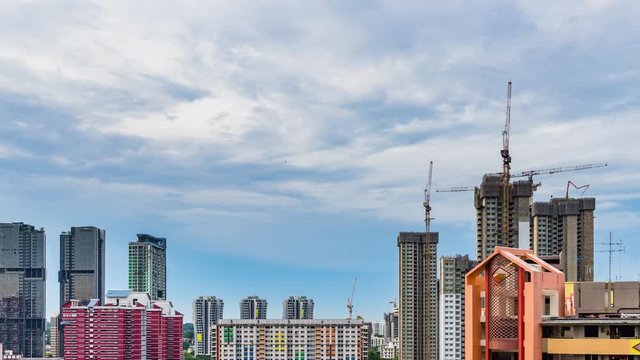 Day to Night view of Construction site in Downtown Singapore skyline with clouds moving, Asia Modern Building